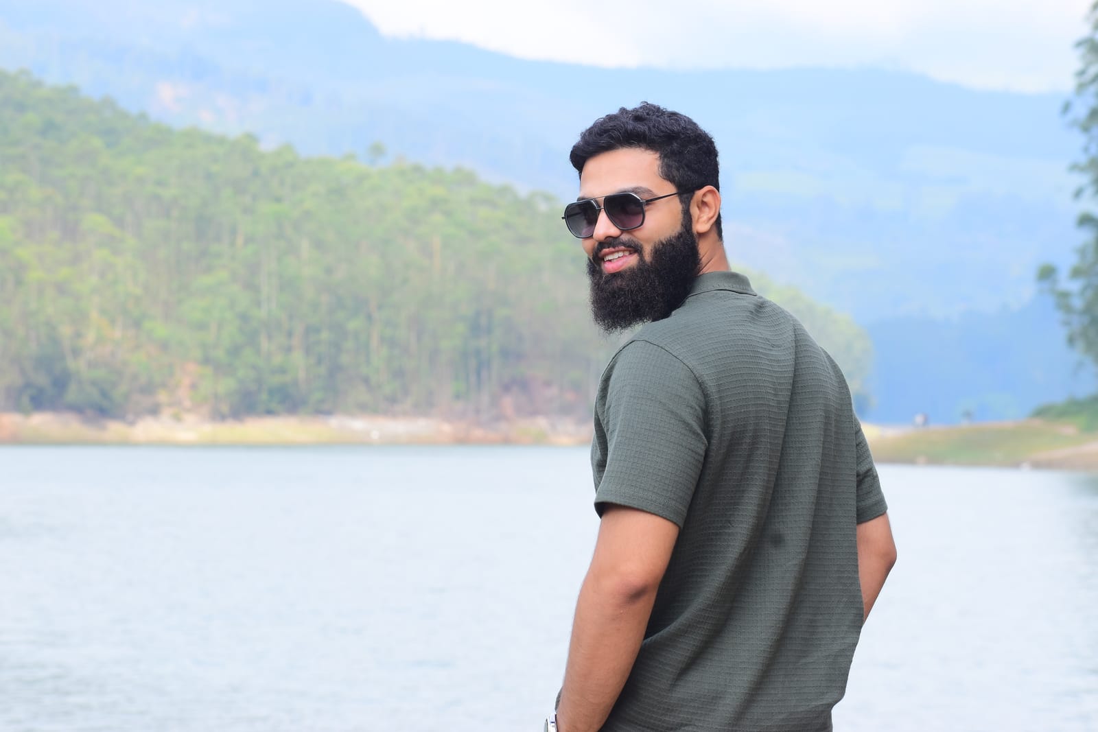 Mohammed Thanedar, founder of 24HourSites, smiling by a lake